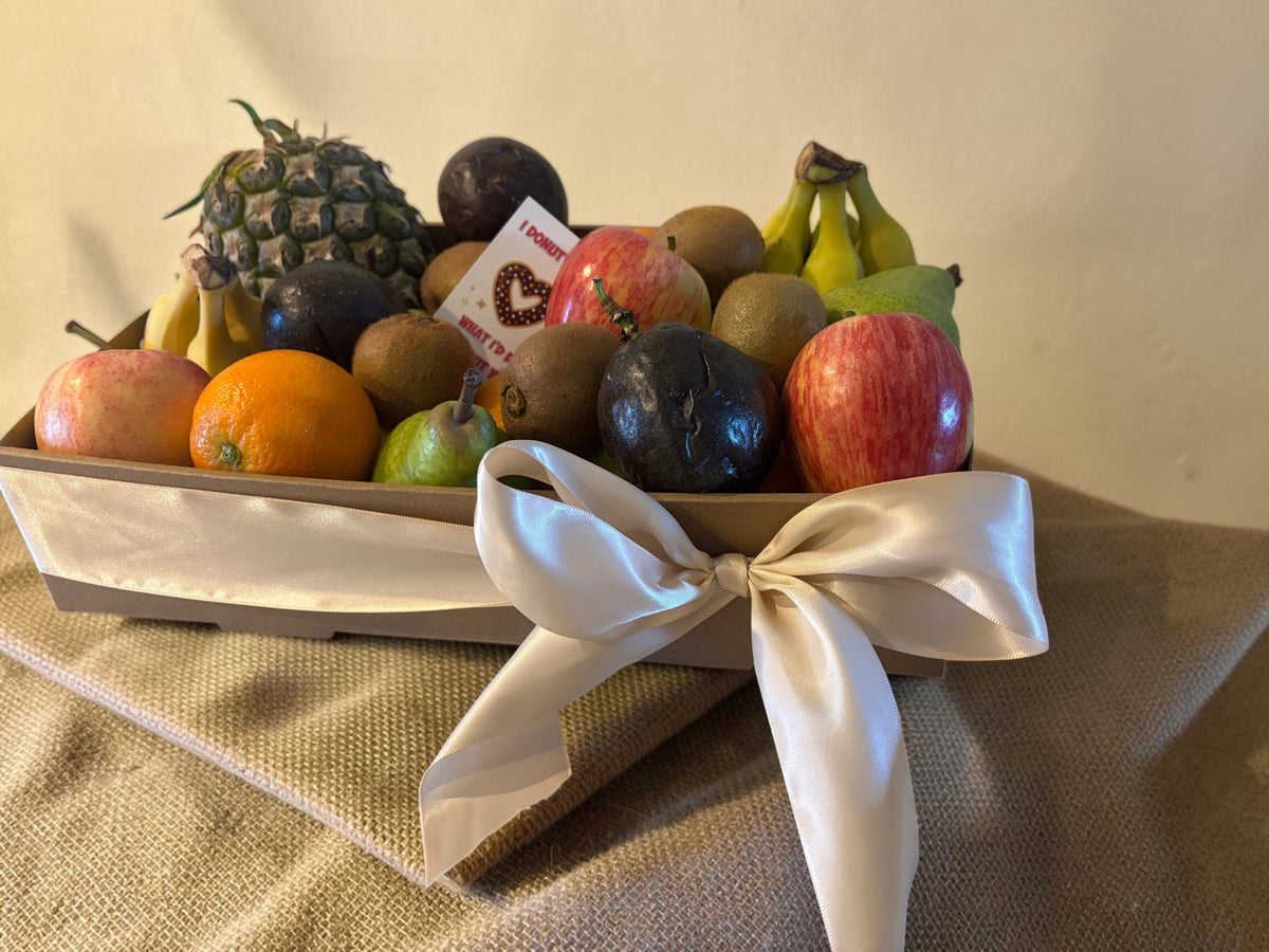 Donut Bouquet Canberra fresh fruit gift hamper featuring assorted seasonal fruits like apples, pears, and pineapple.