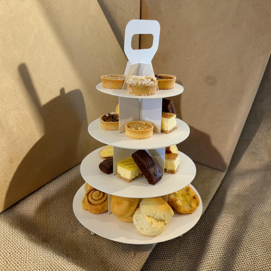 Donut Bouquet Canberra vegan high tea set featuring assorted gourmet cakes, tarts, and pastries on a white stand.