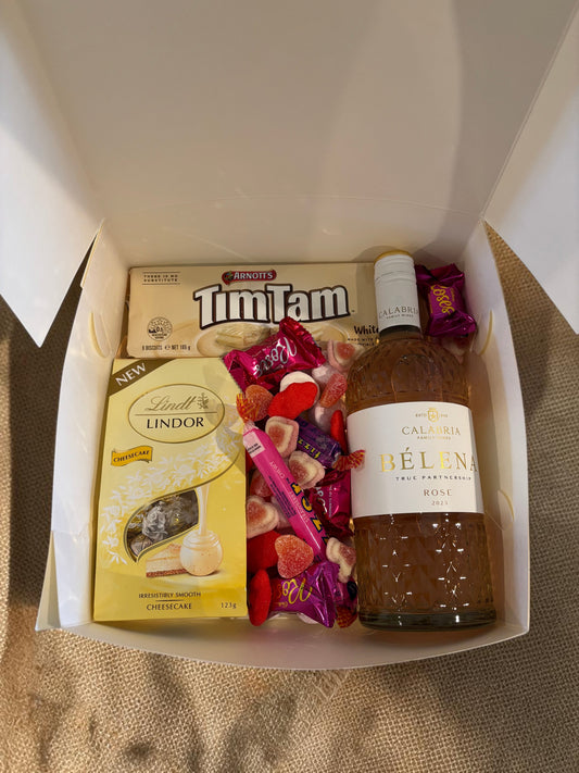 Donut Bouquet Canberra Blushing Rose Hamper with Calabria Rosé, Lindt chocolates, white Tim Tams, and pink lollies.