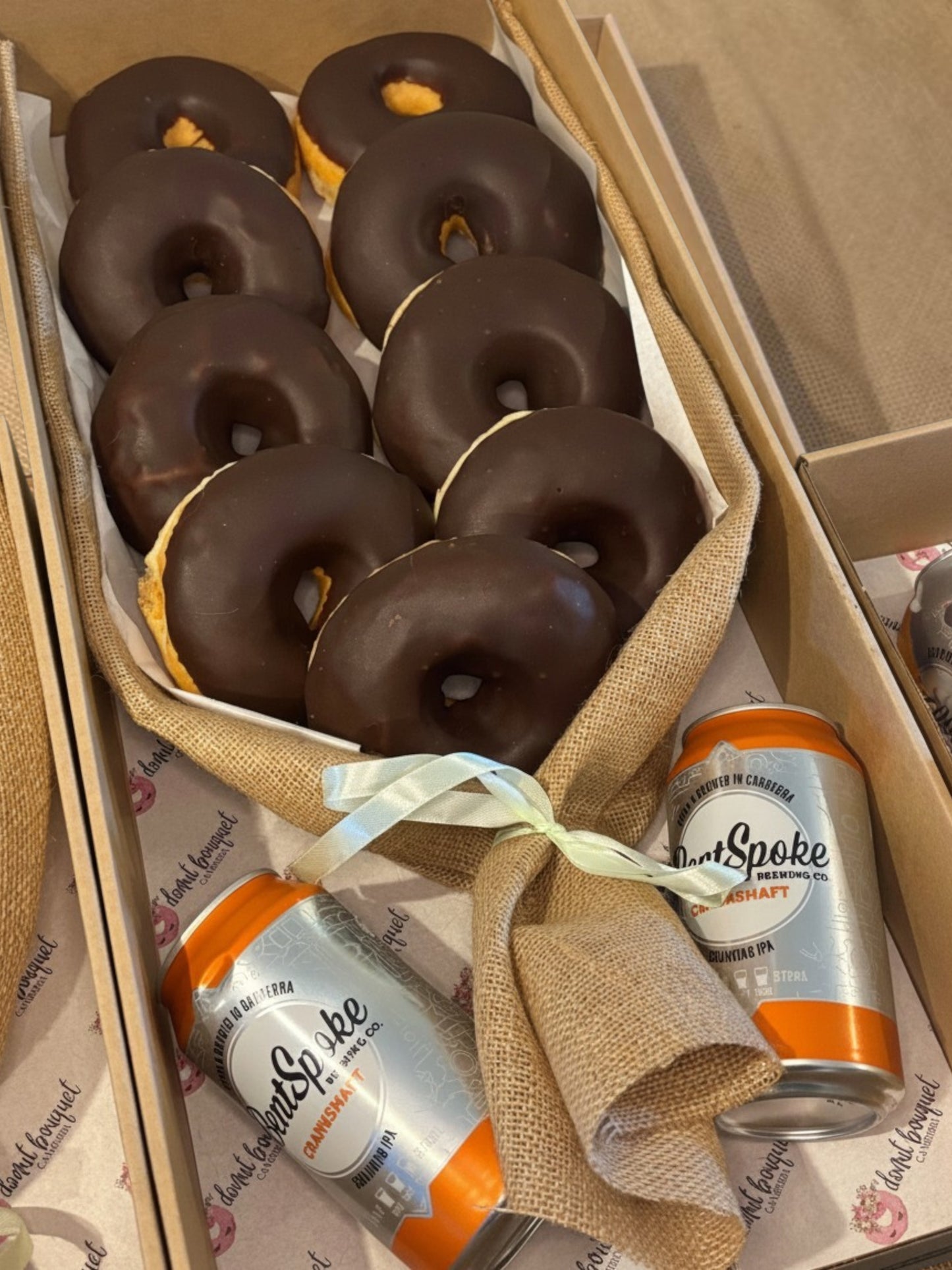 Donut Bouquet Canberra Chocolate Dream bouquet featuring nine oversized chocolate-glazed donuts wrapped in burlap.