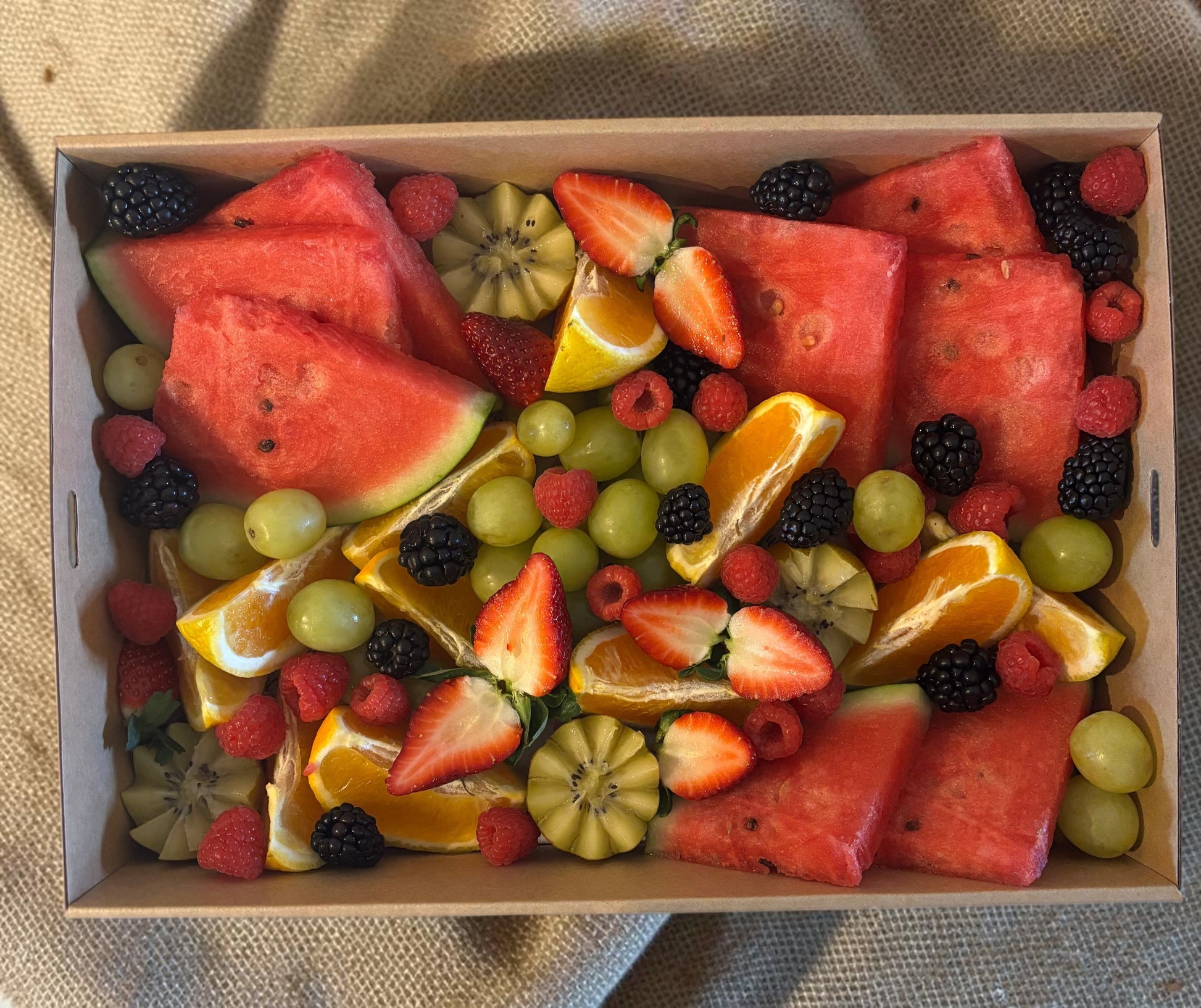 Donut Bouquet Canberra fruit grazing box filled with fresh watermelon, strawberries, blackberries, and grapes and seasonal fruit.