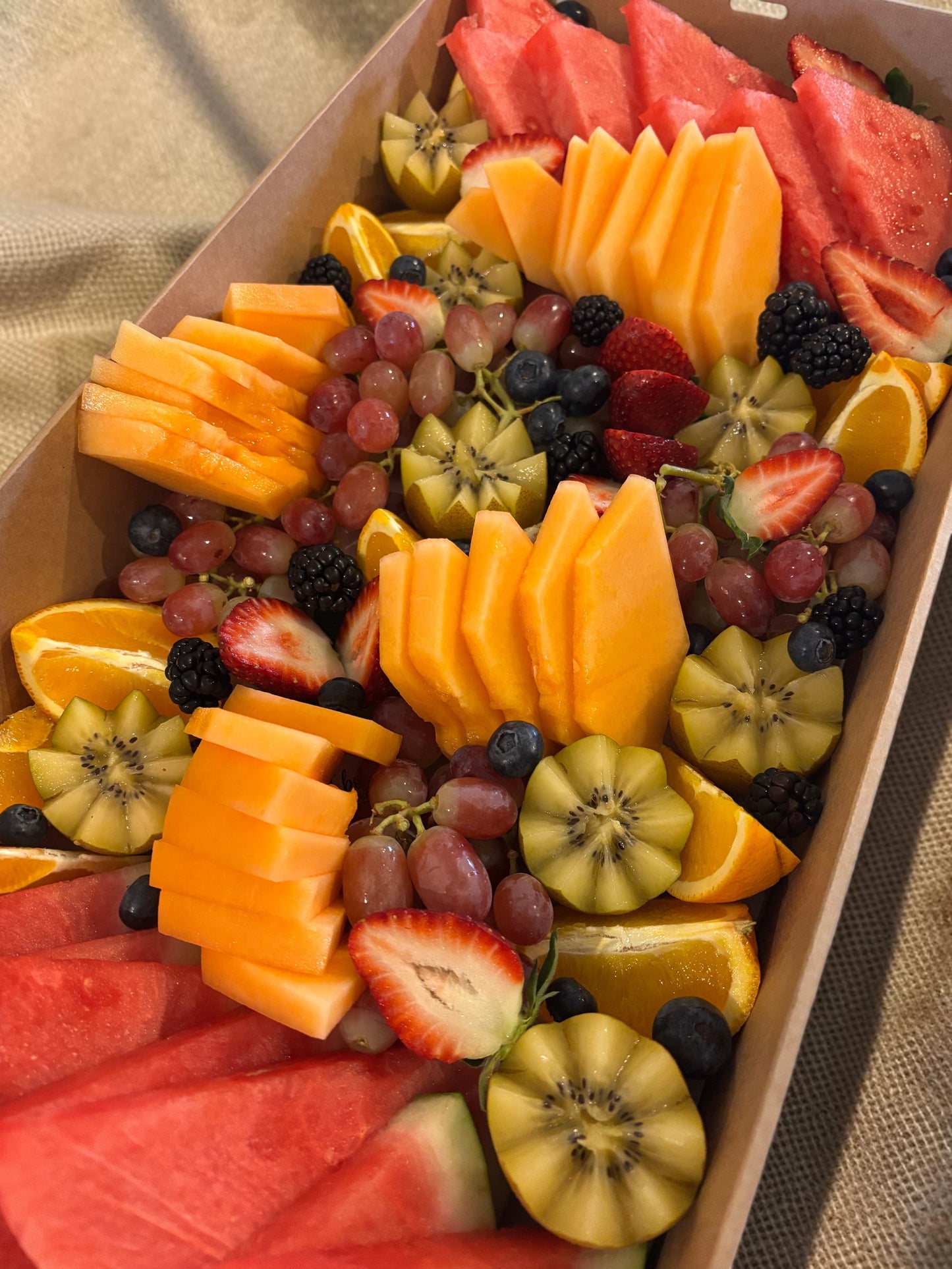 Donut Bouquet Canberra fruit grazing box filled with fresh watermelon, strawberries, blackberries, and grapes and seasonal fruit.