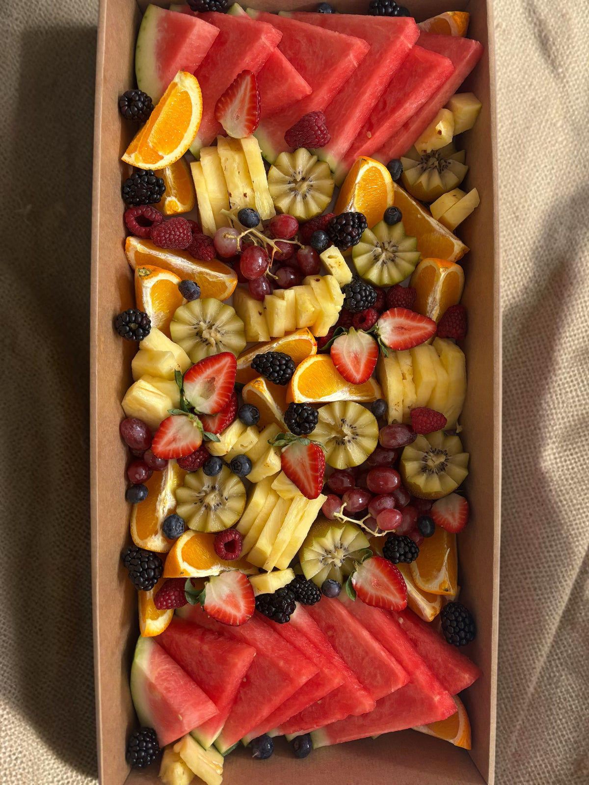 Donut Bouquet Canberra fruit grazing box filled with fresh watermelon, strawberries, blackberries, and grapes and seasonal fruit.