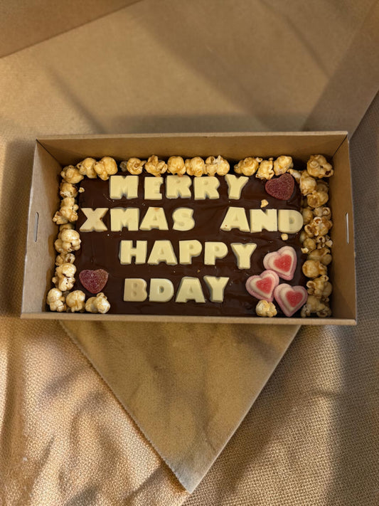 Donut Bouquet Canberra gluten free brownie block with white chocolate message, popcorn, and assorted lollies