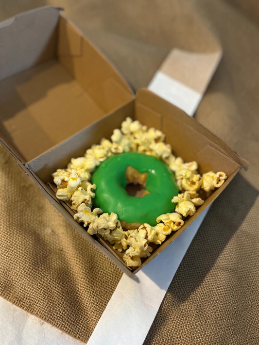 Donut Bouquet Canberra gluten free donut with icing surrounded by popcorn in a cardboard box