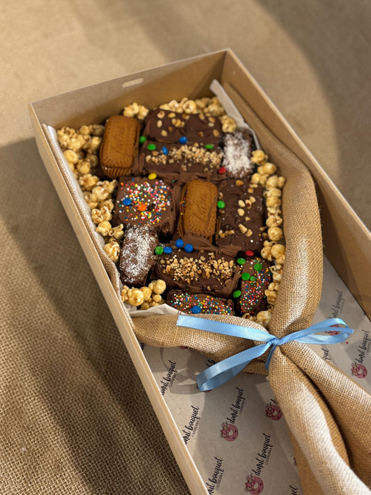 Donut Bouquet Canberra large loaded brownie bouquet gift box with chocolates, M&Ms, and popcorn in a hessian wrap.