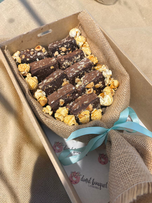 Donut Bouquet Canberra vegan brownie bouquet gift box with nuts and caramel popcorn wrapped in burlap and blue ribbon