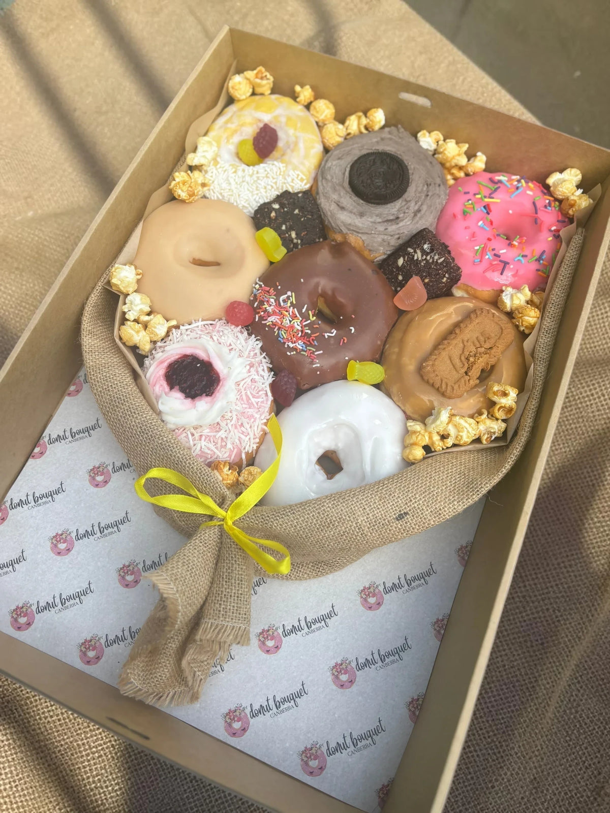 Donut Bouquet Canberra vegan donut bouquet gift box with assorted glazed donuts, brownies, popcorn, and lollies