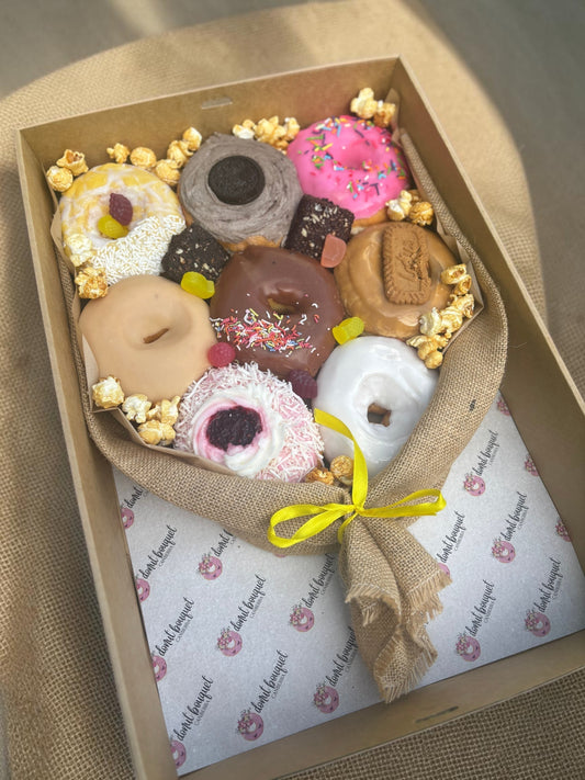 Donut Bouquet Canberra vegan donut bouquet gift box featuring assorted glazed donuts, brownie, and popcorn in hessian.