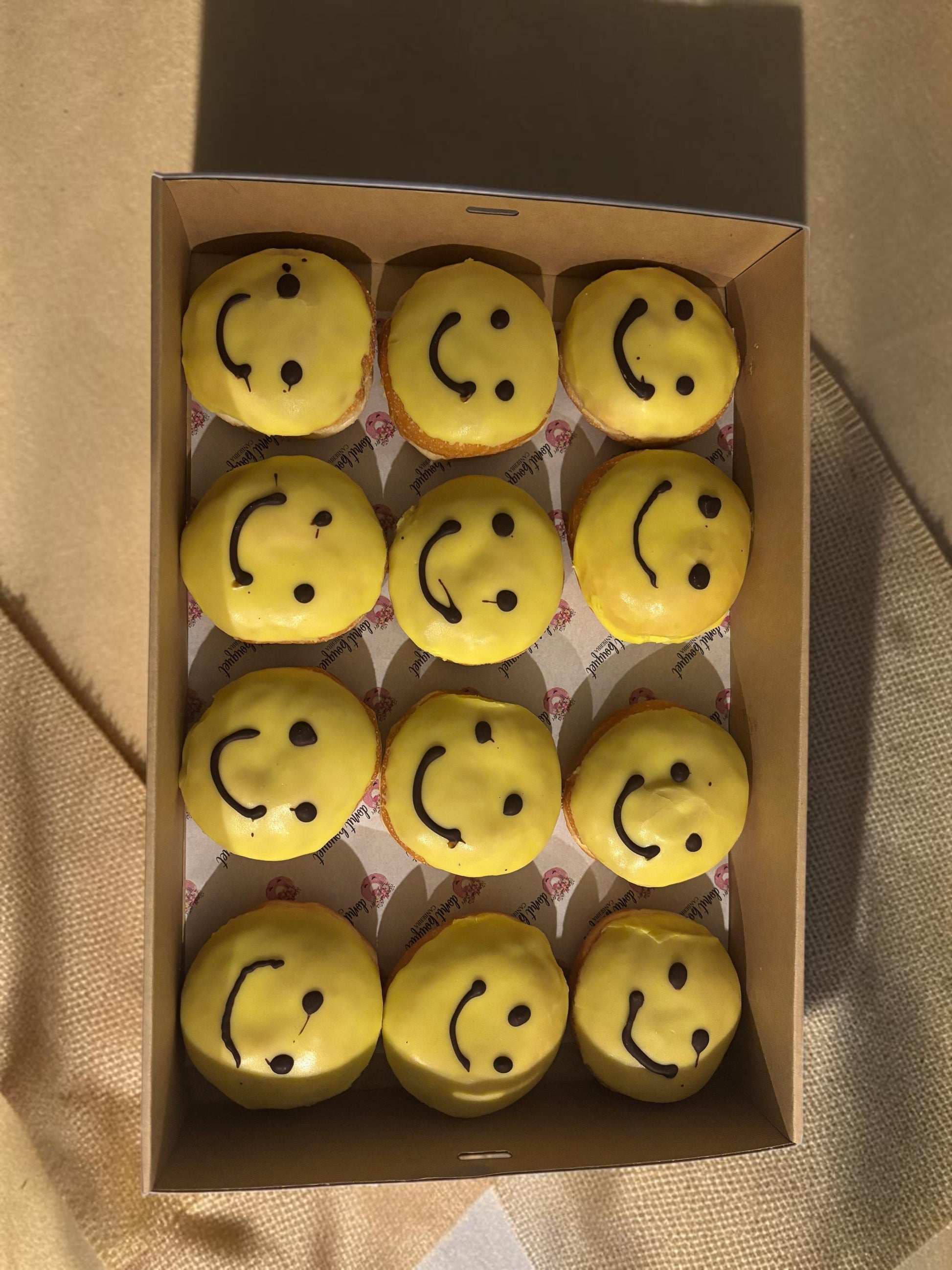 Donut Bouquet Canberra box of yellow smiley face donuts for R U OK Day with chocolate icing smiles